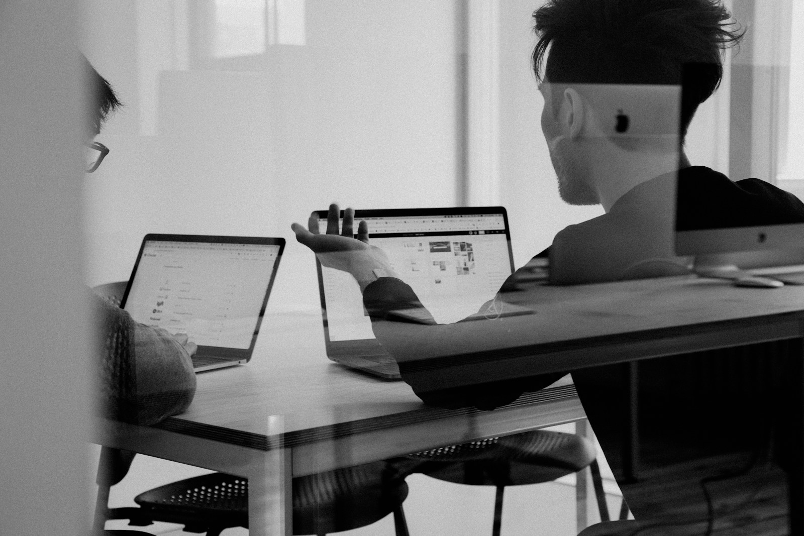 VisualForge AI team sync reviewing brand visual batch outputs